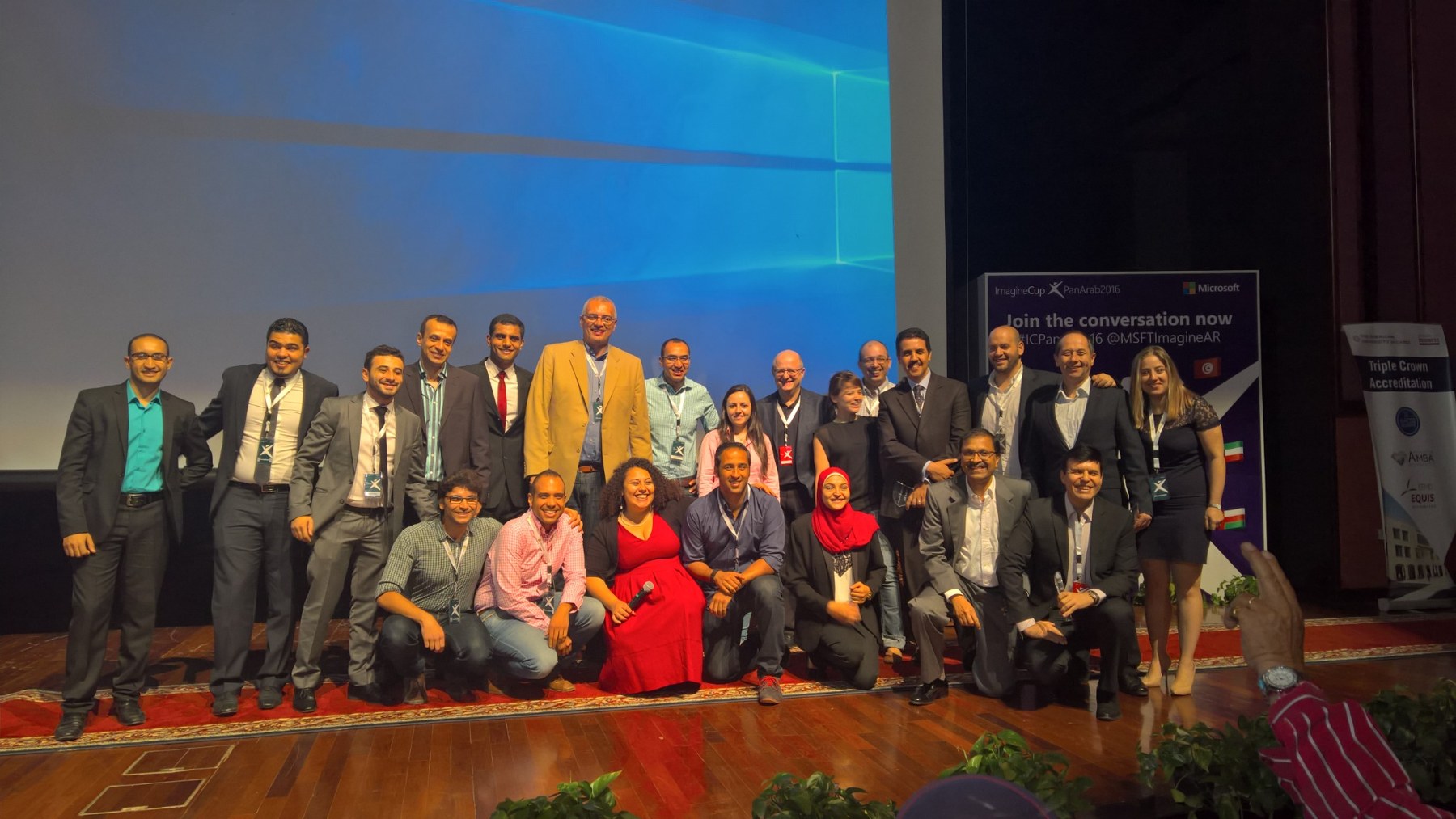 Sherif with event participants on stage